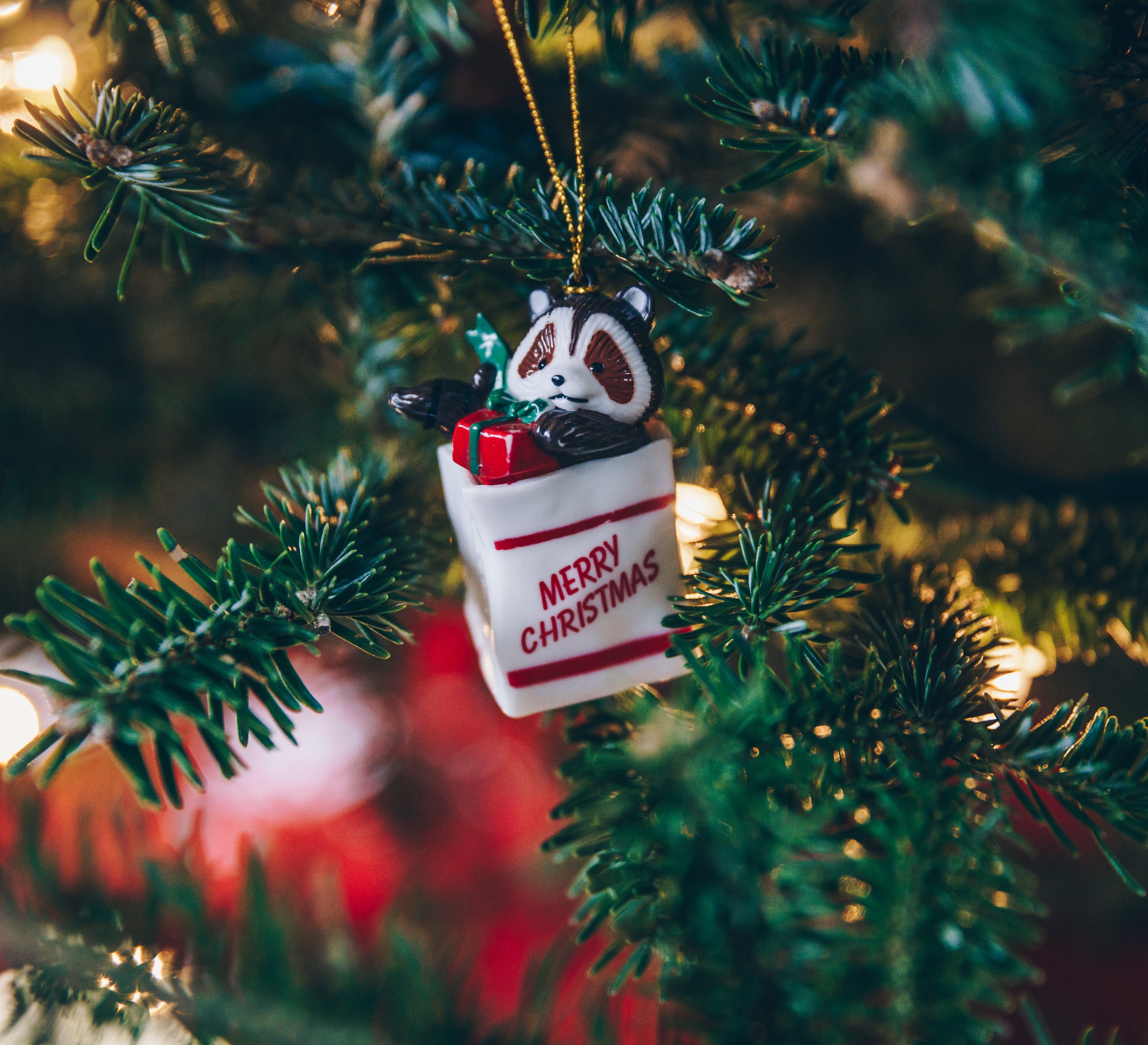 Merry christmas ornament on tree